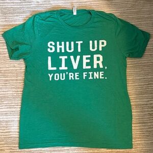 Green tee shirt says it all
